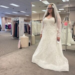 David’s Bridal lace embroidered wedding gown, includes veil. Altered.